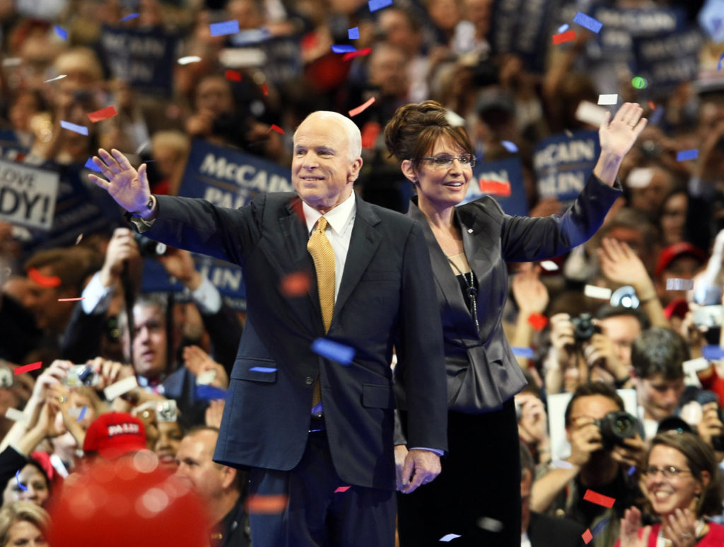 John McCain and Sarah Palin wave to supporters at a 2008 presidential campaign rally